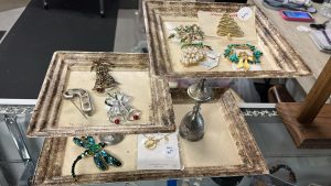 trays of varying heights with an assortment of broaches laid out