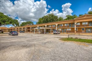 outside of motel with parking lot