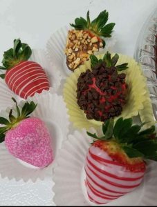 assortment of candy-covered strawberries