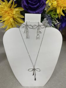 silver bow necklace and matching earrings