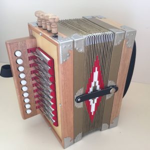 wooden accordion with red detailing