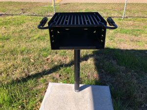 BBQ pit mounted on small concrete slab