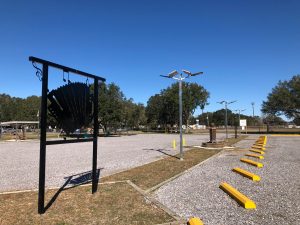 parking lot with lights and accordion sign