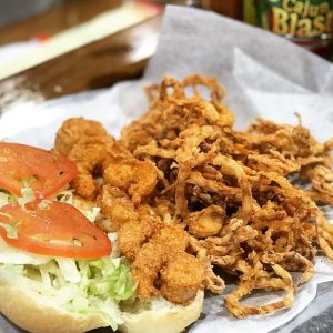 fried shrimp poboy with onion rings