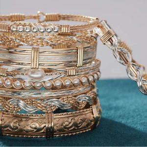 stack of golden bracelets