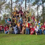 group of traditionally-dressed Mardi Gras runners