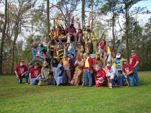 group of traditionally-dressed Mardi Gras runners