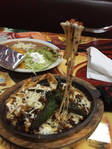 sizzling platter with separate plate of toppings