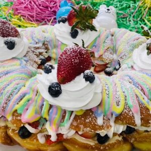 donut cake with icing and fruit