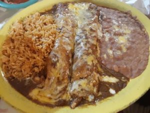 enchiladas with rice and refried beans