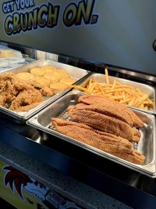 assorted fried foods under hot lights