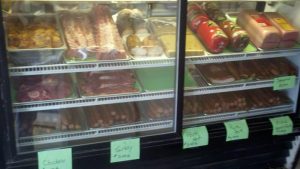 commercial cooler filled with meats