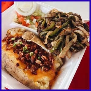 hamburger steak with loaded baked potato and salad