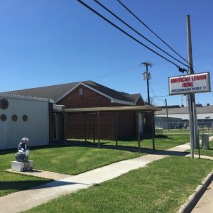 exterior shot of American Legion Post 77 with sign in front