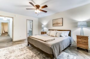 master bedroom with bathroom in the background