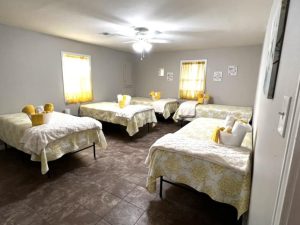 large bedroom with five beds