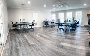 large room with tables set up for crafting