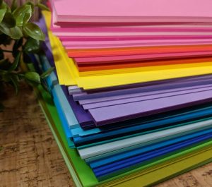 stack of different colored papers