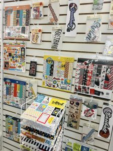 store wall with crafting/scrapbooking supplies hanging