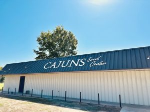 outside of metal building with Cajuns Event Center sign