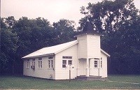small white, wooden church building