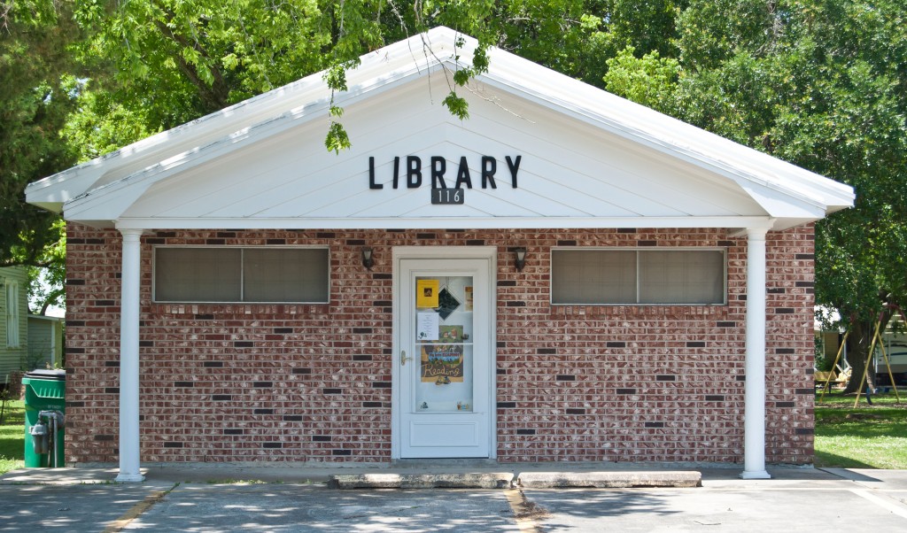 small brick building with library written on front