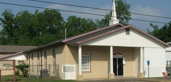 beige brick church building with steeple