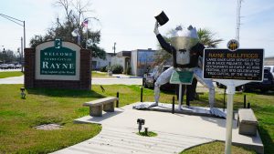 Rayne, Louisiana welcome sign and giant metal frog statue