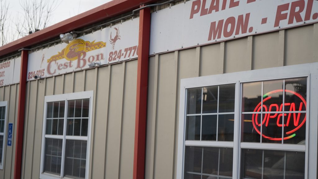 Metal building with signage across the top, C'est Bon restaurant in Mermentau