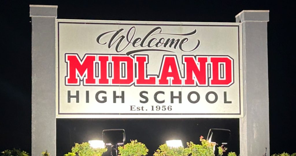Midland High School sign between two pillars