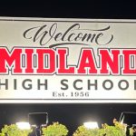 Midland High School sign between two pillars