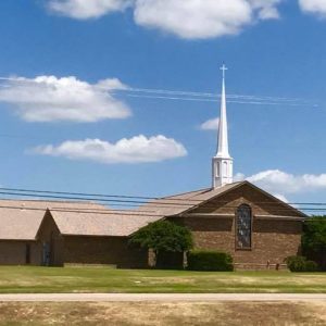 brick church building with steeple on top