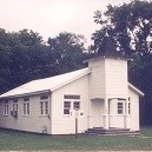 small white, wooden church building