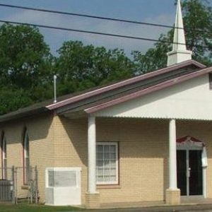 beige brick church building with steeple