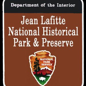 Jean Lafitte National Historical Park and Preserve with arrowhead national park service logo on a brown background