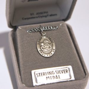 religious medal in a jewelry box