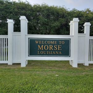 white fence with Welcome to Morse, Louisiana sign