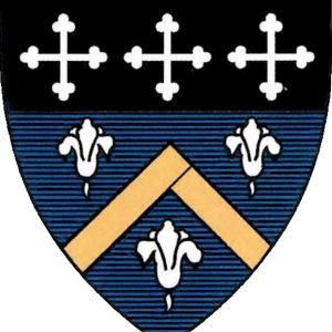 shield featuring black top with three white crosses. The bottom of the shied is a blue background with three white flowers