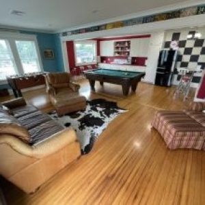 game room with furniture, pool table, and foosball table