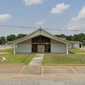 Church building with American flag flying out front